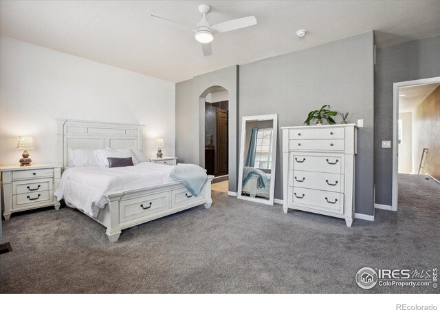 16031 W 63rd Ln W Unit D, Arvada, CO 80403 - bedroom with arched walkways, dark colored carpet, and ceiling fan