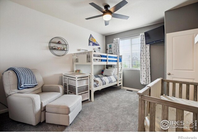 16031 W 63rd Ln W Unit D, Arvada, CO 80403 - bedroom featuring carpet floors, baseboards, and ceiling fan