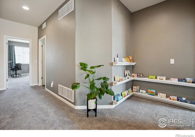 16031 W 63rd Ln W Unit D, Arvada, CO 80403 - hallway featuring carpet floors and baseboards