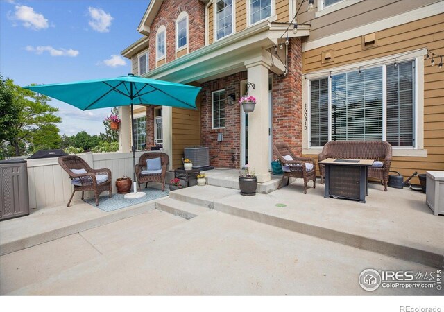 16031 W 63rd Ln W Unit D, Arvada, CO 80403 - view of patio / terrace featuring central AC unit