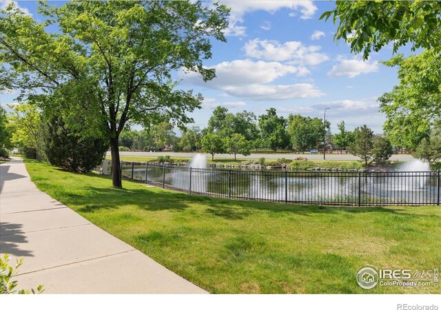 16031 W 63rd Ln W Unit D, Arvada, CO 80403 - view of yard featuring a water view