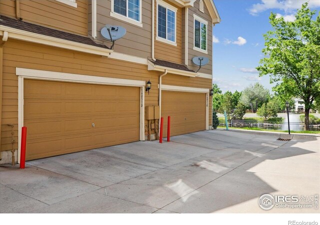 16031 W 63rd Ln W Unit D, Arvada, CO 80403 - garage featuring concrete driveway