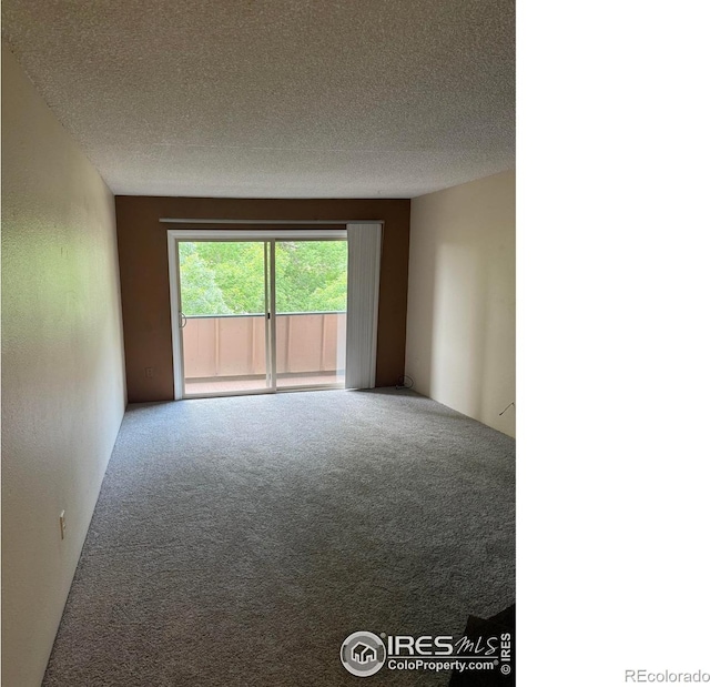 5102 Williams Fork Trl Unit 205, Boulder, CO 80301 - carpeted spare room with a textured ceiling