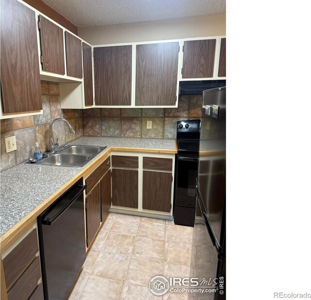 5102 Williams Fork Trl Unit 205, Boulder, CO 80301 - kitchen with dishwashing machine, a sink, black / electric stove, refrigerator, and decorative backsplash