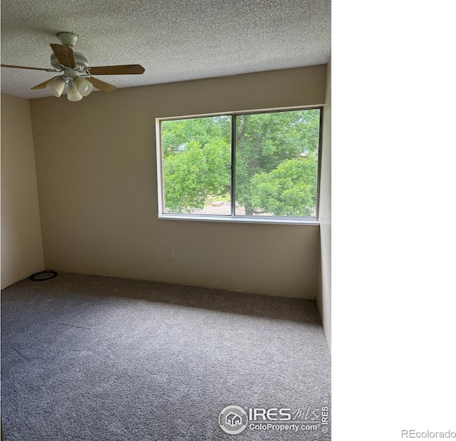 5102 Williams Fork Trl Unit 205, Boulder, CO 80301 - carpeted spare room featuring a ceiling fan and a textured ceiling