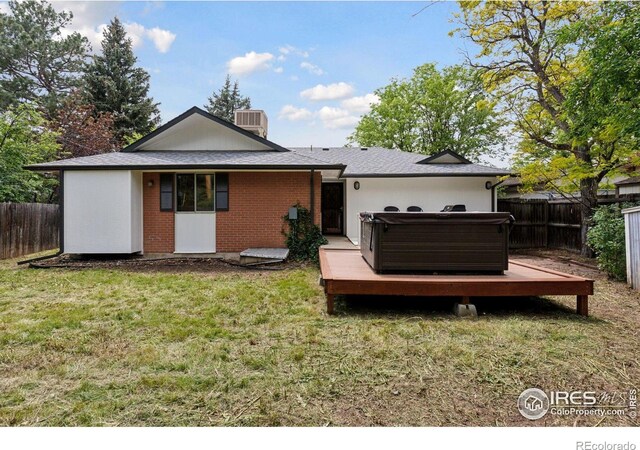 800 Mohawk Dr, Boulder, CO 80303 - back of property with a wooden deck, brick siding, and central air condition unit