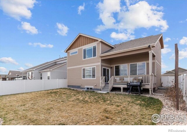 1718 101st Avenue Ct, Greeley, CO 80634 - back of property featuring a wooden deck and board and batten siding