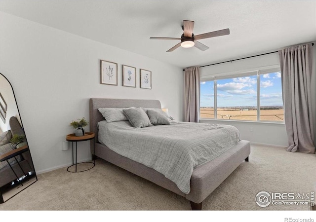 1718 101st Avenue Ct, Greeley, CO 80634 - bedroom with carpet floors, baseboards, and a ceiling fan
