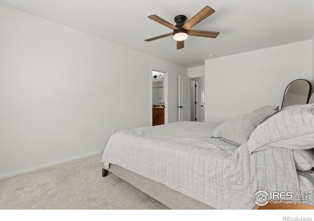 1718 101st Avenue Ct, Greeley, CO 80634 - carpeted bedroom featuring baseboards, ceiling fan, and ensuite bath