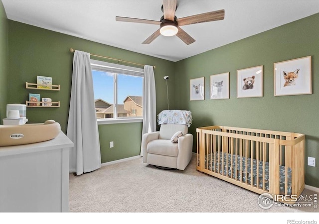 1718 101st Avenue Ct, Greeley, CO 80634 - bedroom featuring a crib, carpet floors, baseboards, and ceiling fan