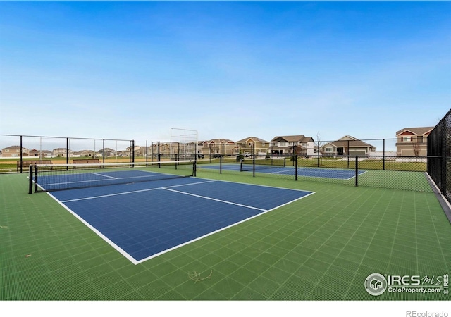 1718 101st Avenue Ct, Greeley, CO 80634 - view of tennis court with community basketball court and a residential view