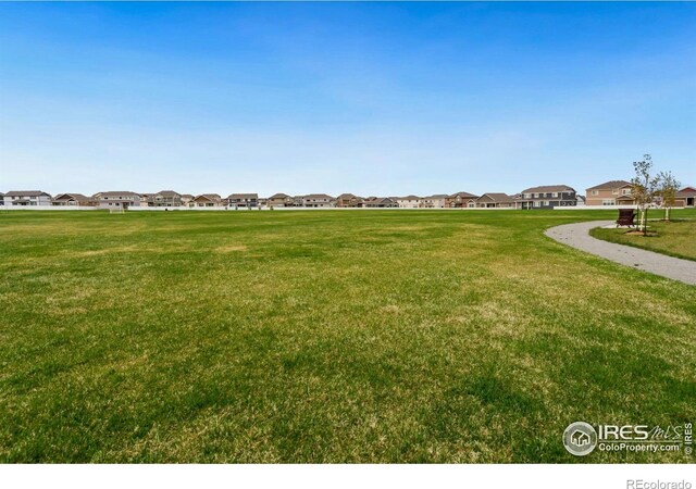 1718 101st Avenue Ct, Greeley, CO 80634 - view of community with a residential view and a lawn