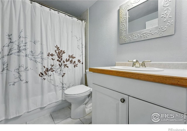 2133 Indian Peaks Cir, Longmont, CO 80504 - bathroom featuring vanity, tile patterned flooring, a textured wall, and shower / bath combo