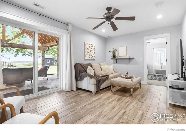 9139 County Road 54, Milliken, CO 80543 - living room featuring light wood finished floors, a ceiling fan, and recessed lighting