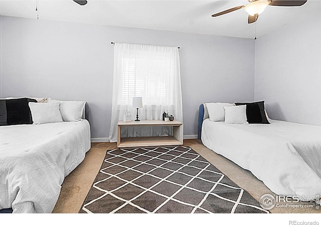 9139 County Road 54, Milliken, CO 80543 - carpeted bedroom featuring ceiling fan and baseboards