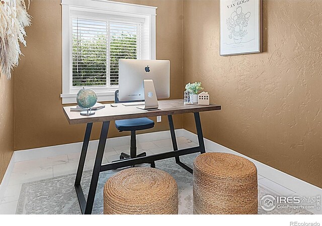9139 County Road 54, Milliken, CO 80543 - office with a textured wall and baseboards