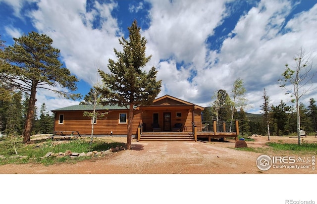 56 Pamlico Ct, Red Feather Lakes, CO 80545 - chalet / cabin with a wooden deck