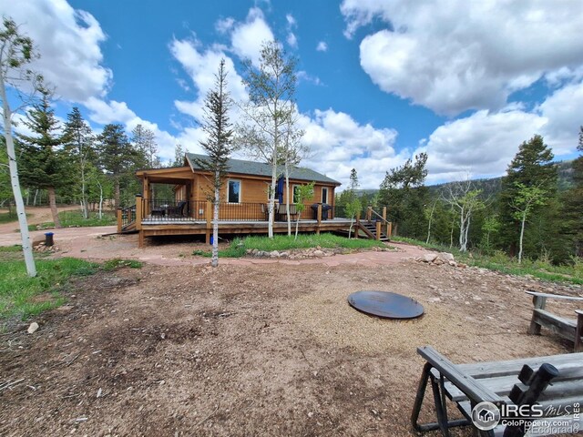 56 Pamlico Ct, Red Feather Lakes, CO 80545 - back of house with a wooden deck