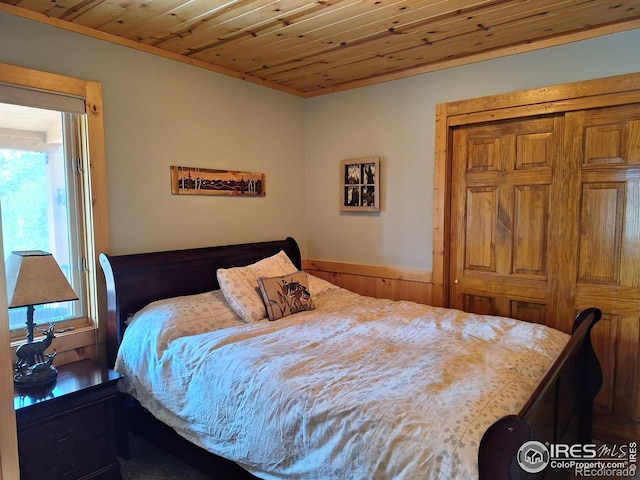 56 Pamlico Ct, Red Feather Lakes, CO 80545 - bedroom featuring multiple windows, wood ceiling, and ornamental molding