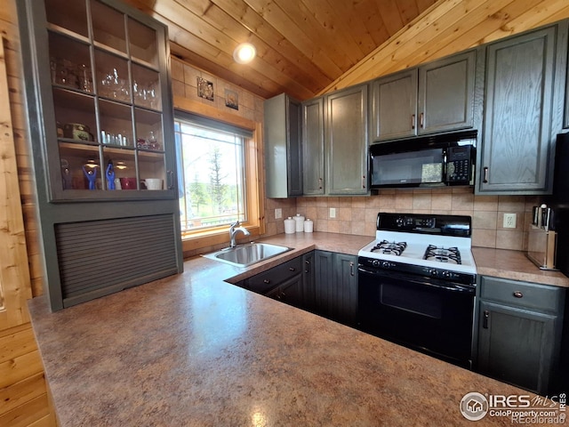 56 Pamlico Ct, Red Feather Lakes, CO 80545 - kitchen with gas range, black microwave, a sink, backsplash, and glass insert cabinets