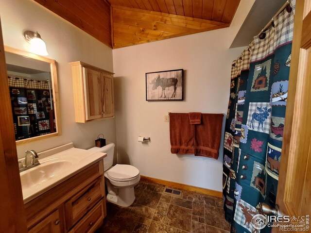 56 Pamlico Ct, Red Feather Lakes, CO 80545 - bathroom with vanity, wood ceiling, baseboards, toilet, and stone finish floors