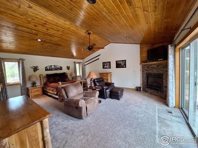 56 Pamlico Ct, Red Feather Lakes, CO 80545 - living room with wood ceiling, carpet, lofted ceiling, a fireplace, and ceiling fan