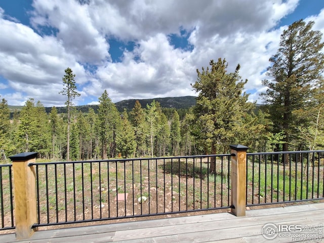 56 Pamlico Ct, Red Feather Lakes, CO 80545 - view of mountain background with a heavily wooded area