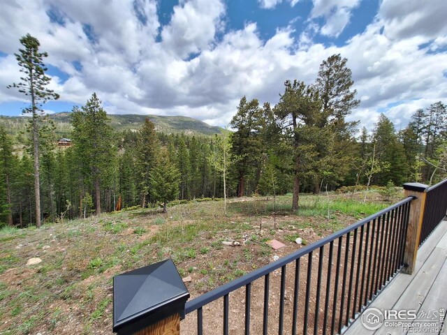 56 Pamlico Ct, Red Feather Lakes, CO 80545 - view of yard featuring a wooded view