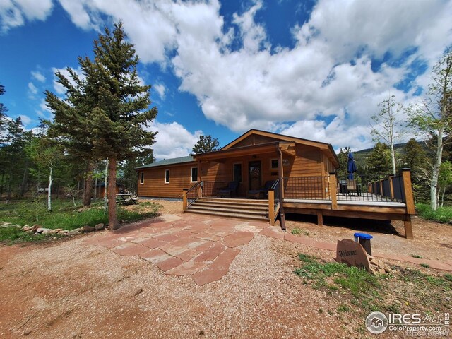 56 Pamlico Ct, Red Feather Lakes, CO 80545 - view of rustic home