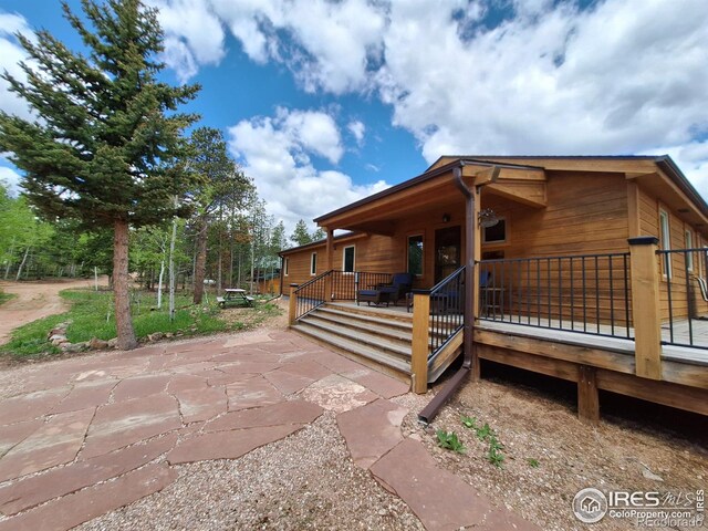 56 Pamlico Ct, Red Feather Lakes, CO 80545 - view of side of home featuring a wooden deck