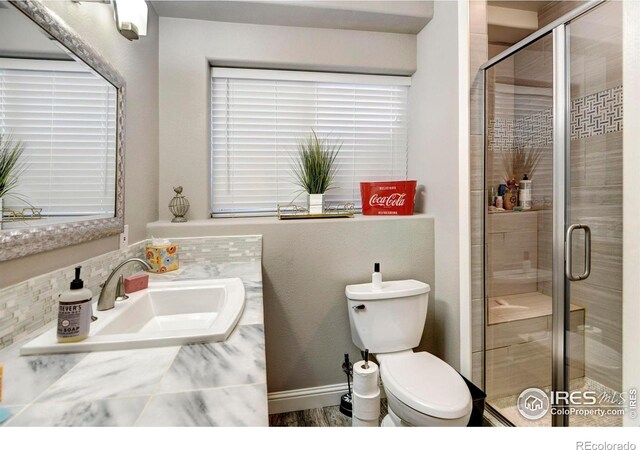 5895 E Conservation Dr, Frederick, CO 80504 - full bathroom featuring toilet, a stall shower, and vanity