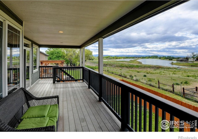 5895 E Conservation Dr, Frederick, CO 80504 - wooden terrace featuring a water view
