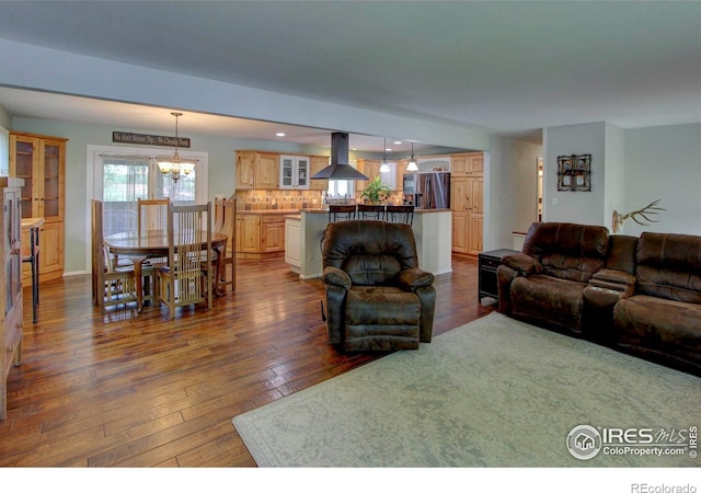 204 35th St SW, Loveland, CO 80537 - living area featuring a chandelier, dark wood finished floors, and recessed lighting