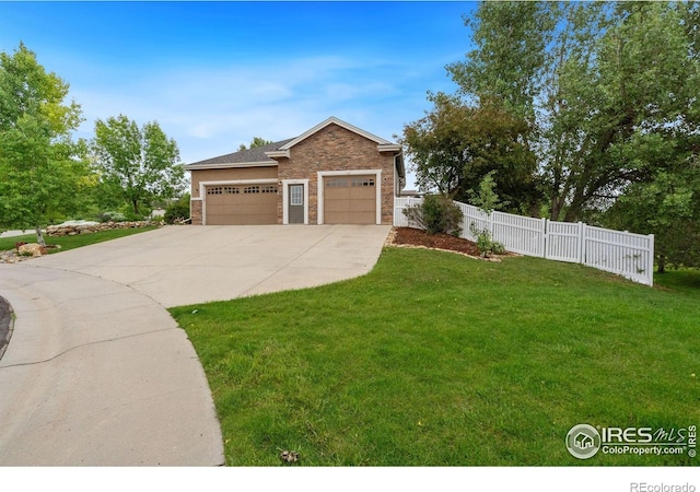 1926 Crested Butte Ct, Loveland, CO 80538 - view of front of property with stone siding, concrete driveway, and an attached garage