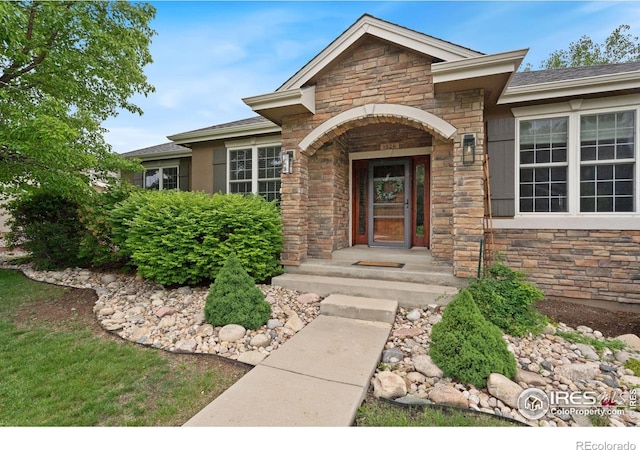 1926 Crested Butte Ct, Loveland, CO 80538 - doorway to property featuring stone siding
