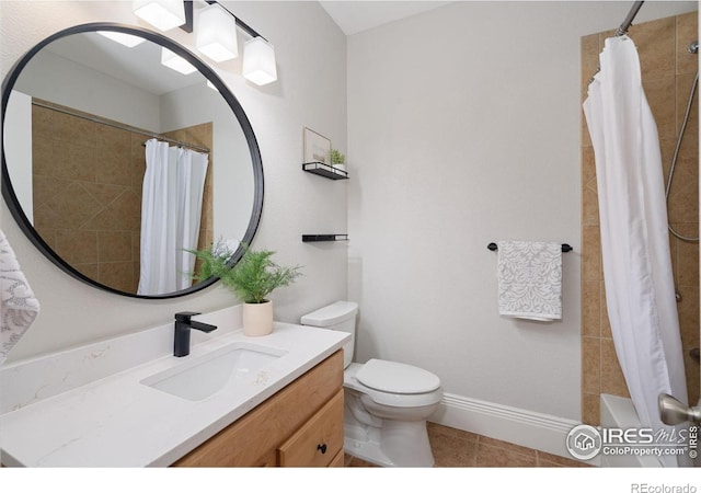 1926 Crested Butte Ct, Loveland, CO 80538 - bathroom featuring vanity, toilet, tile patterned flooring, and shower / bath combo with shower curtain
