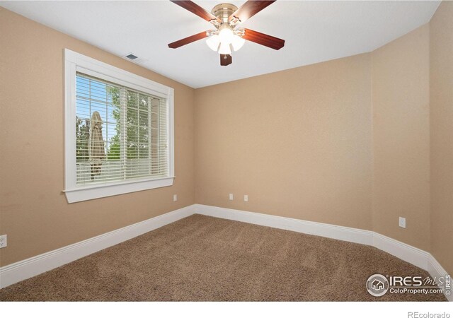 1926 Crested Butte Ct, Loveland, CO 80538 - spare room featuring carpet floors, ceiling fan, and baseboards