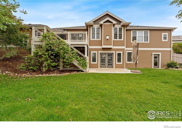 1926 Crested Butte Ct, Loveland, CO 80538 - back of property featuring a patio area, stairway, a yard, a deck, and french doors