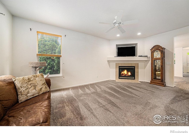 1874 Ute Creek Dr, Longmont, CO 80504 - carpeted living room with a tile fireplace, recessed lighting, a ceiling fan, and baseboards