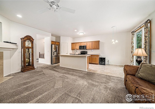 1874 Ute Creek Dr, Longmont, CO 80504 - living area with light carpet, baseboards, ceiling fan, and recessed lighting
