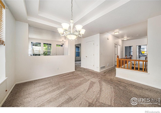 1874 Ute Creek Dr, Longmont, CO 80504 - carpeted spare room featuring a chandelier and baseboards