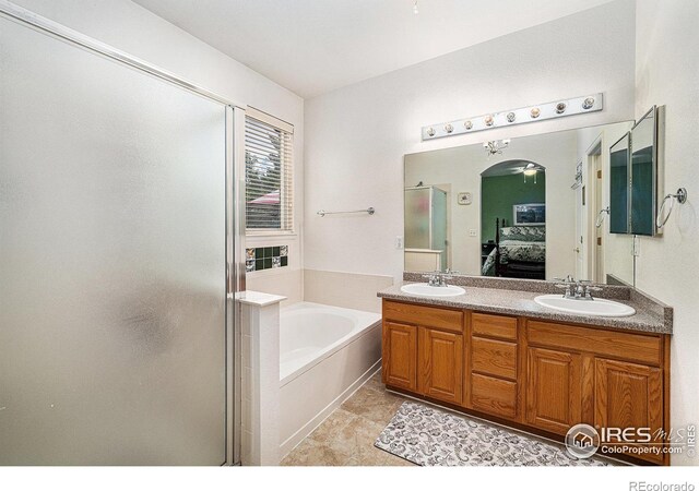 1874 Ute Creek Dr, Longmont, CO 80504 - ensuite bathroom with a garden tub, double vanity, and a shower stall