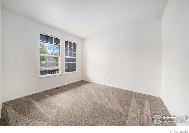 1874 Ute Creek Dr, Longmont, CO 80504 - carpeted spare room featuring baseboards
