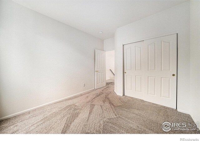 1874 Ute Creek Dr, Longmont, CO 80504 - unfurnished bedroom with carpet, baseboards, and a closet