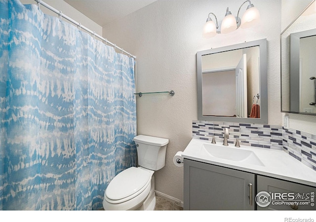 1874 Ute Creek Dr, Longmont, CO 80504 - bathroom featuring vanity, toilet, tasteful backsplash, a textured wall, and curtained shower