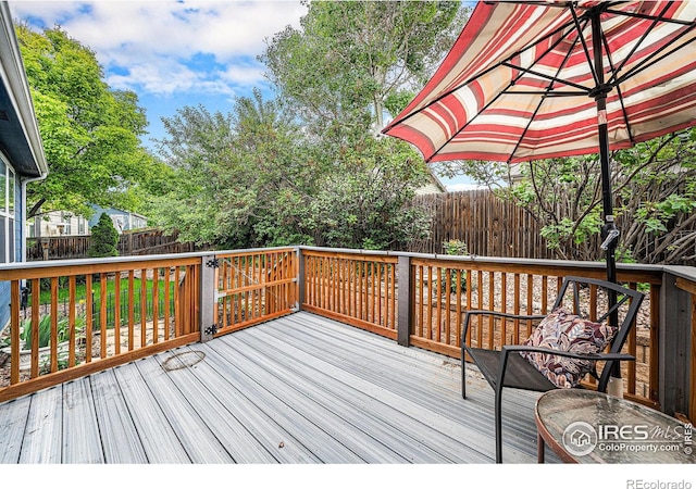 1874 Ute Creek Dr, Longmont, CO 80504 - wooden deck featuring a fenced backyard