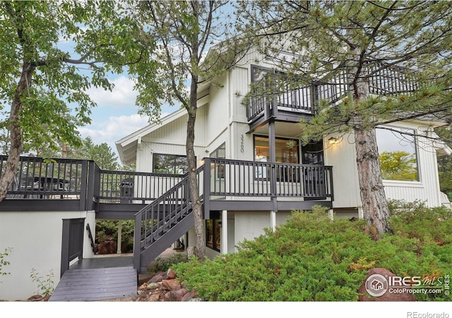 3260 Lafayette Dr, Boulder, CO 80305 - view of side of home with a balcony, stairs, and a wooden deck