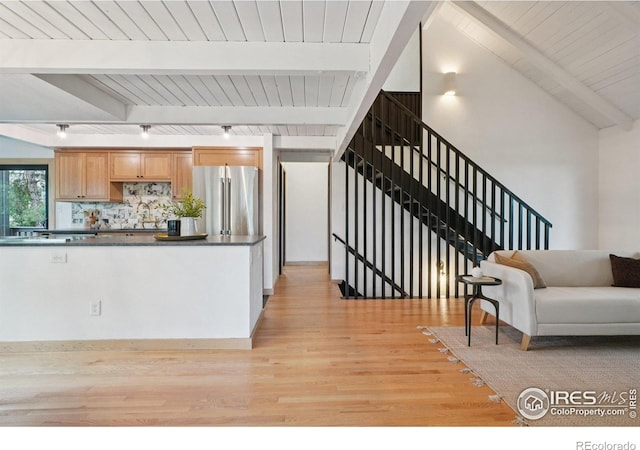 3260 Lafayette Dr, Boulder, CO 80305 - living area with light wood-type flooring, wooden ceiling with exposed beams, track lighting, and stairs