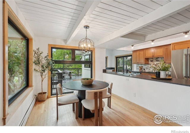 3260 Lafayette Dr, Boulder, CO 80305 - dining space with baseboard heating, light wood-style flooring, a chandelier, rail lighting, and wooden ceiling with exposed beams