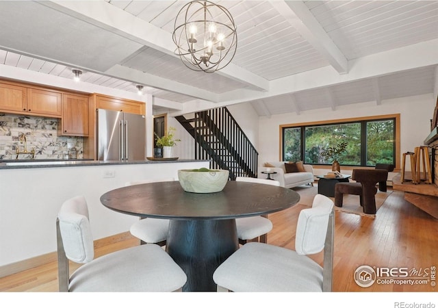 3260 Lafayette Dr, Boulder, CO 80305 - dining room with a chandelier, stairway, light wood-style floors, and wood ceiling with exposed beams